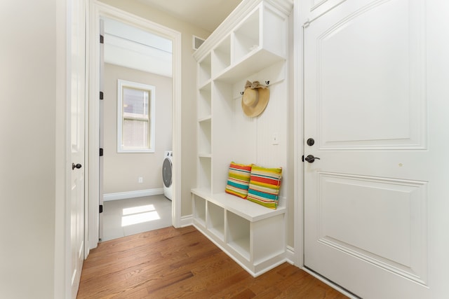 10408 Stoney Point Dr, South Lyon, MI 48178 - mudroom with wood finished floors, washer / clothes dryer, and baseboards