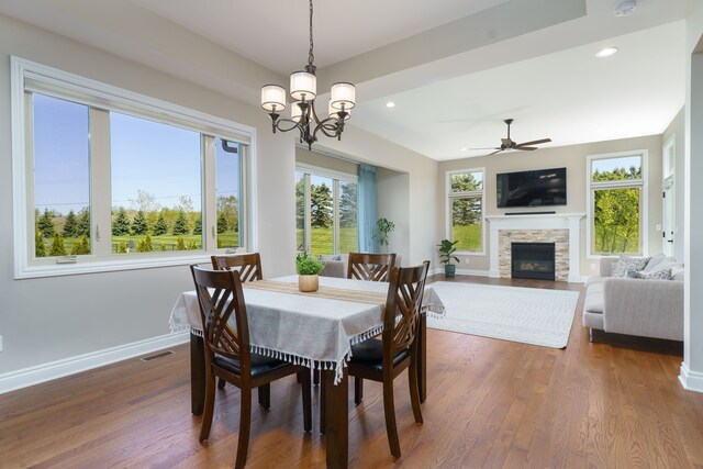 10408 Stoney Point Dr, South Lyon, MI 48178 - dining area featuring a stone fireplace, dark wood finished floors, baseboards, a ceiling fan, and recessed lighting