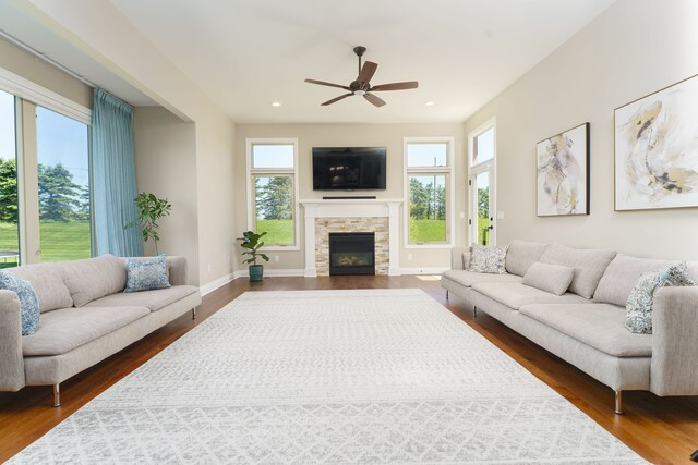 10408 Stoney Point Dr, South Lyon, MI 48178 - living area with healthy amount of natural light, dark wood-style floors, ceiling fan, and recessed lighting