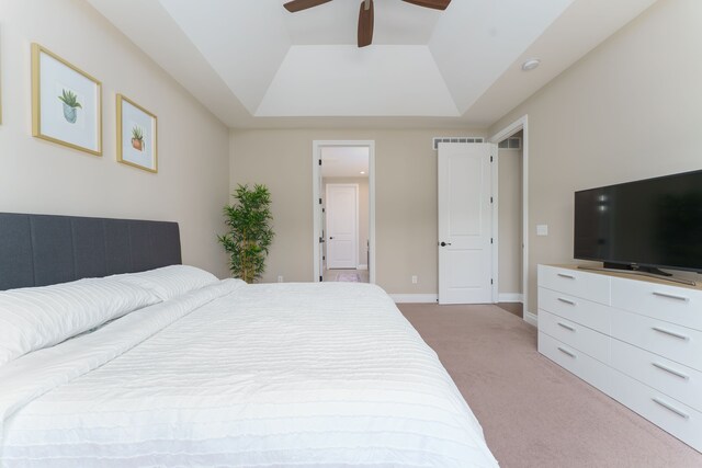 10408 Stoney Point Dr, South Lyon, MI 48178 - bedroom featuring light carpet, a tray ceiling, ceiling fan, and baseboards