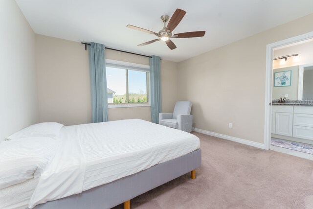 10408 Stoney Point Dr, South Lyon, MI 48178 - bedroom featuring light colored carpet, baseboards, a ceiling fan, and ensuite bath