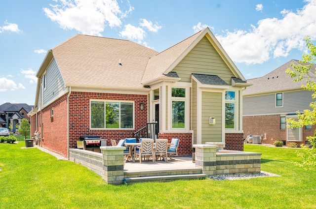 10408 Stoney Point Dr, South Lyon, MI 48178 - rear view of house with brick siding, a patio area, a yard, roof with shingles, and cooling unit