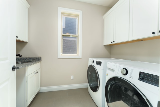10408 Stoney Point Dr, South Lyon, MI 48178 - laundry room featuring cabinet space, washing machine and clothes dryer, and baseboards