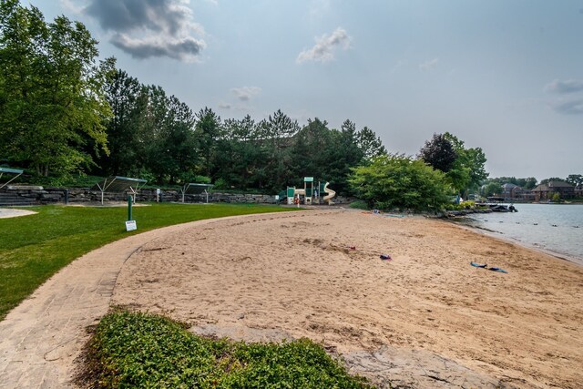 10408 Stoney Point Dr, South Lyon, MI 48178 - view of community featuring view of water and beach and a yard