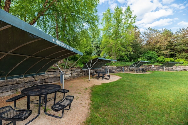 10408 Stoney Point Dr, South Lyon, MI 48178 - view of grassy yard featuring an outdoor fire pit