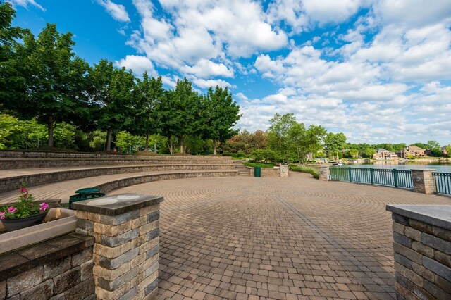 10408 Stoney Point Dr, South Lyon, MI 48178 - view of patio / terrace featuring a water view and fence