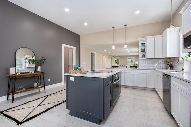 3401 Hicks Ave, Benton Harbor, MI 49022 - kitchen featuring a sink, light wood-type flooring, white cabinets, decorative backsplash, and recessed lighting