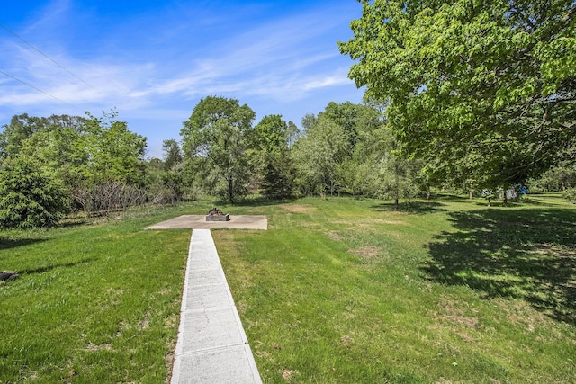 3401 Hicks Ave, Benton Harbor, MI 49022 - view of green lawn featuring an outdoor fire pit and a patio