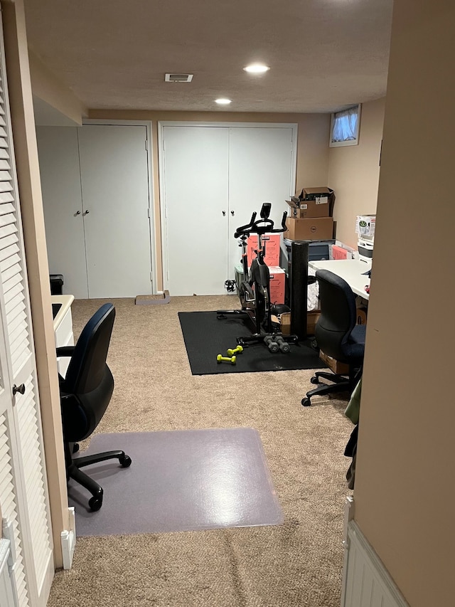 carpeted office featuring recessed lighting