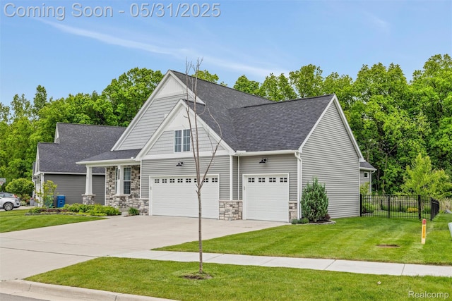 4280 Rolling Meadow Ln, Ypsilanti, MI 48197 - view of front of house with driveway, a shingled roof, stone siding, and an attached garage