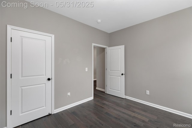 4280 Rolling Meadow Ln, Ypsilanti, MI 48197 - unfurnished bedroom featuring dark wood-style flooring and baseboards