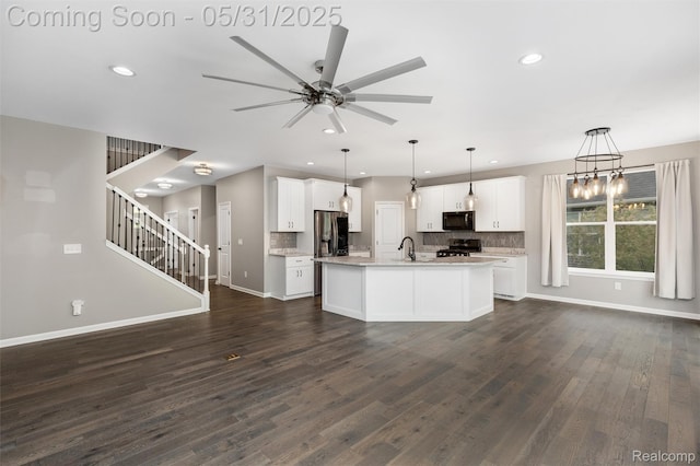 4280 Rolling Meadow Ln, Ypsilanti, MI 48197 - kitchen with black microwave, ceiling fan, open floor plan, backsplash, and recessed lighting