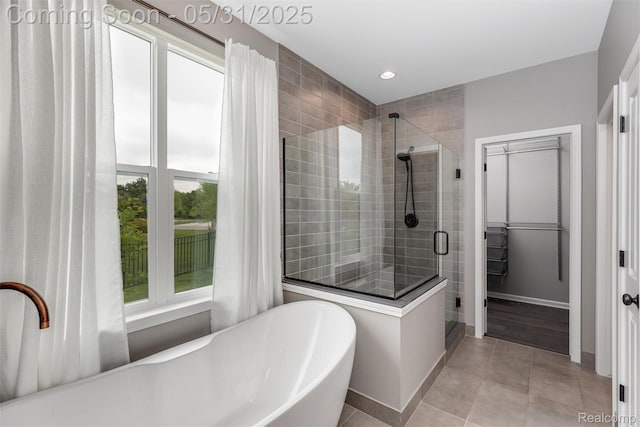 4280 Rolling Meadow Ln, Ypsilanti, MI 48197 - full bath with a shower stall, a freestanding tub, tile patterned flooring, baseboards, and recessed lighting