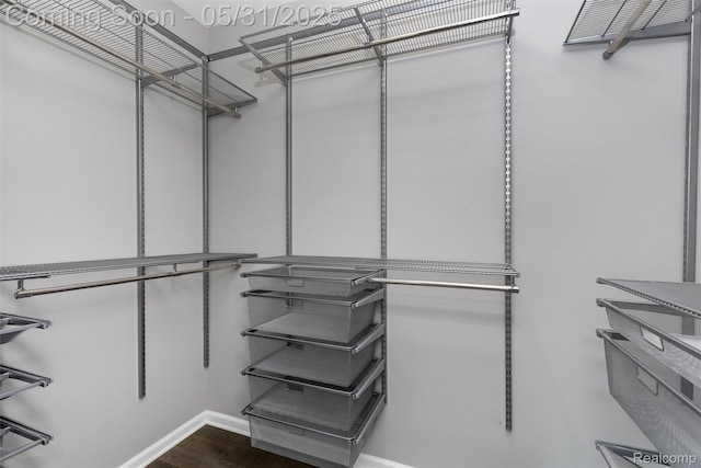 4280 Rolling Meadow Ln, Ypsilanti, MI 48197 - spacious closet featuring dark wood finished floors