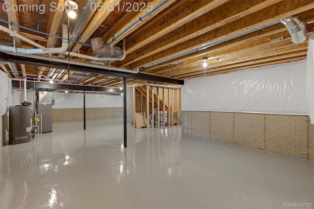 4280 Rolling Meadow Ln, Ypsilanti, MI 48197 - unfinished basement with water heater, heating unit, and brick wall