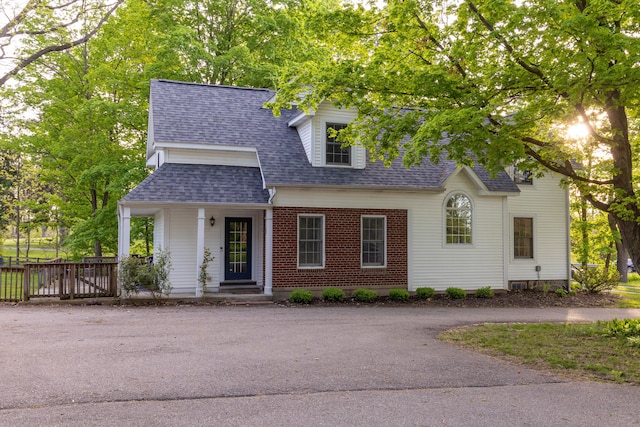 5100 Perry Rd, Grand Blanc, MI 48439 - view of front of property with a shingled roof and brick siding