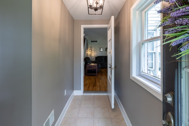 5100 Perry Rd, Grand Blanc, MI 48439 - doorway to outside with baseboards, healthy amount of natural light, and light tile patterned floors