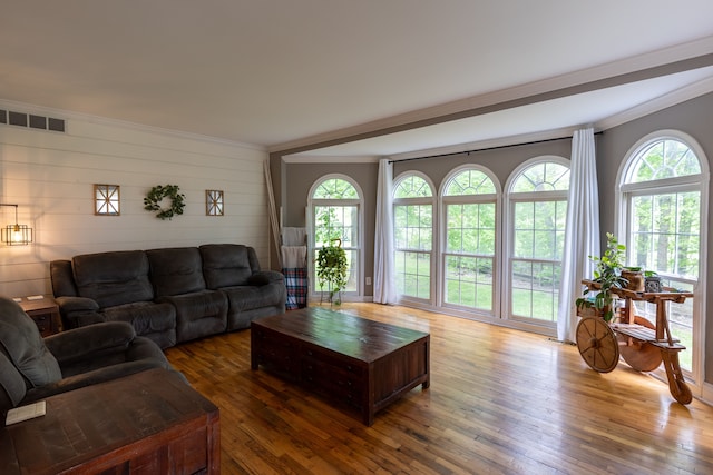 5100 Perry Rd, Grand Blanc, MI 48439 - living room featuring hardwood / wood-style floors, crown molding, and wood walls