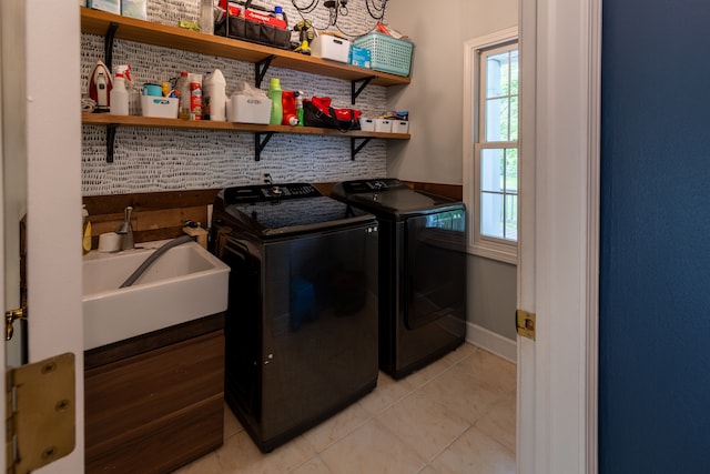 5100 Perry Rd, Grand Blanc, MI 48439 - laundry room with independent washer and dryer, light tile patterned floors, and baseboards