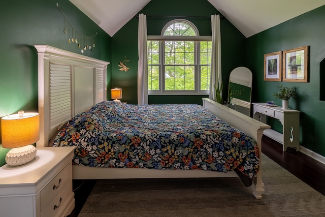 5100 Perry Rd, Grand Blanc, MI 48439 - bedroom featuring dark wood-style floors, lofted ceiling, and baseboards