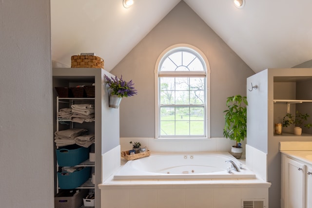 5100 Perry Rd, Grand Blanc, MI 48439 - bathroom with plenty of natural light, a whirlpool tub, vaulted ceiling, vanity, and a shower