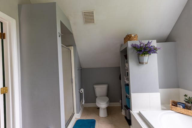 5100 Perry Rd, Grand Blanc, MI 48439 - full bath featuring a stall shower, vaulted ceiling, toilet, tile patterned floors, and a bathtub