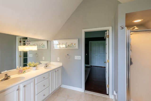 5100 Perry Rd, Grand Blanc, MI 48439 - full bath with vaulted ceiling, tile patterned floors, baseboards, double vanity, and a shower with door