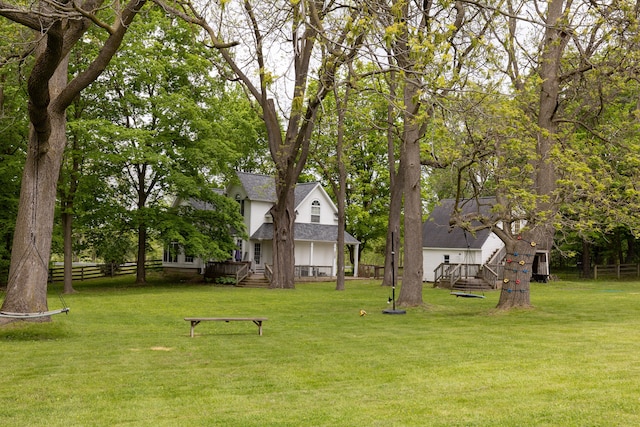 5100 Perry Rd, Grand Blanc, MI 48439 - view of yard with a wooden deck