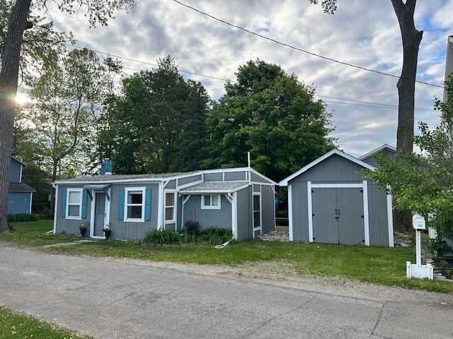 11181 W Ferndale Dr, Manitou Beach, MI 49253 - view of front of property featuring a storage unit and an outbuilding