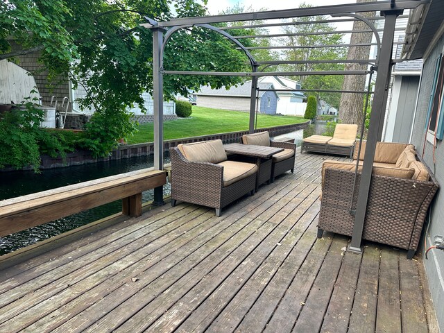 11181 W Ferndale Dr, Manitou Beach, MI 49253 - wooden deck with outdoor lounge area and a lawn