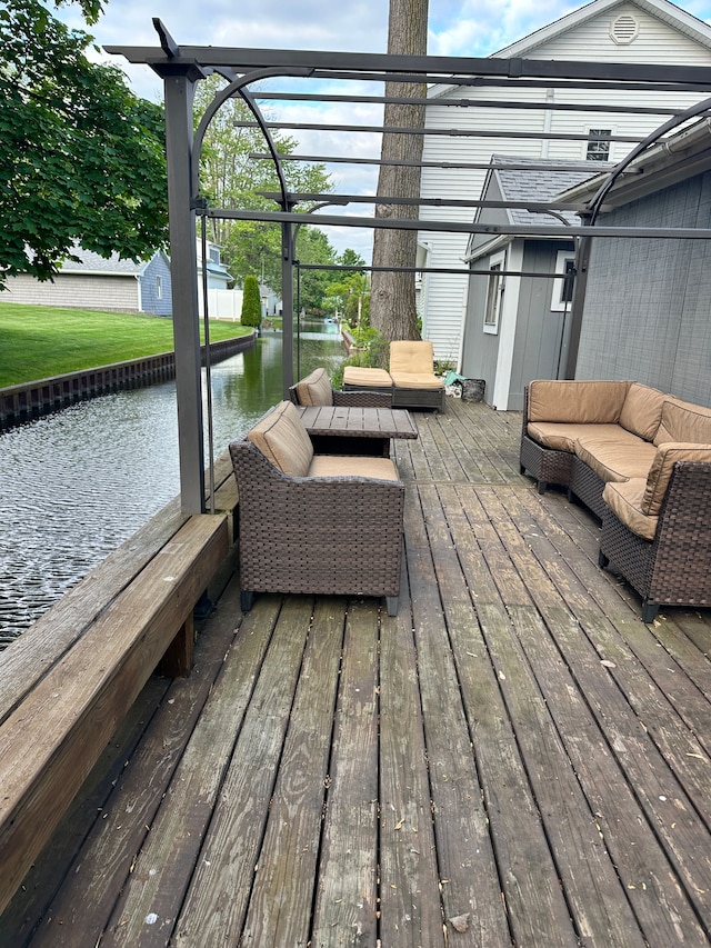 11181 W Ferndale Dr, Manitou Beach, MI 49253 - deck featuring an outdoor hangout area and a water view