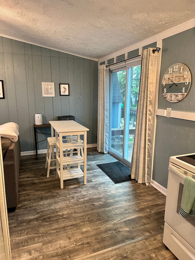 11181 W Ferndale Dr, Manitou Beach, MI 49253 - dining space with a textured ceiling and wood finished floors
