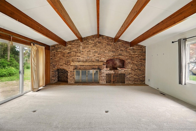 2332 Nolen Dr, Flint, MI 48504 - unfurnished living room with a brick fireplace, carpet flooring, and brick wall