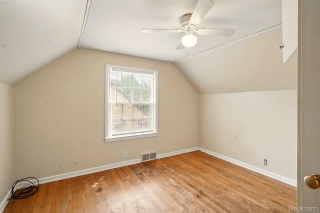 2332 Nolen Dr, Flint, MI 48504 - bonus room with lofted ceiling, wood-type flooring, ceiling fan, and baseboards