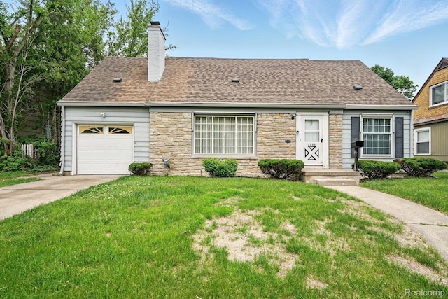 2332 Nolen Dr, Flint, MI 48504 - view of front of property featuring stone siding, a chimney, driveway, a front yard, and a garage