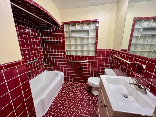2332 Nolen Dr, Flint, MI 48504 - full bath featuring tile walls, a tub to relax in, wainscoting, and vanity