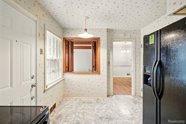 2332 Nolen Dr, Flint, MI 48504 - bathroom featuring wallpapered walls and a chandelier