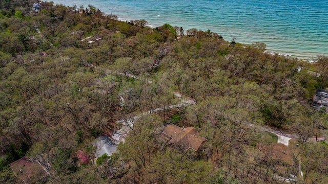 aerial view of property and surrounding area with a large body of water