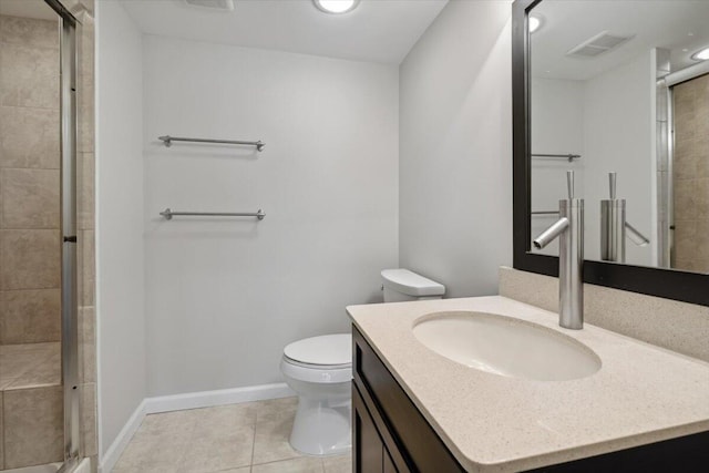 full bath with tile patterned floors, baseboards, a shower stall, toilet, and vanity
