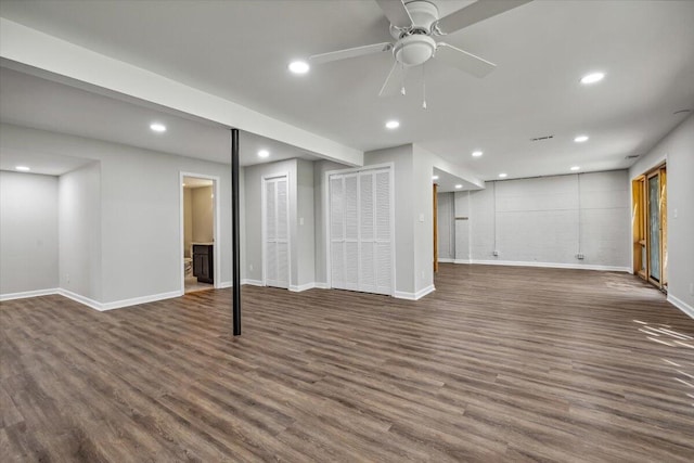 finished basement with dark wood-style floors, baseboards, recessed lighting, and ceiling fan