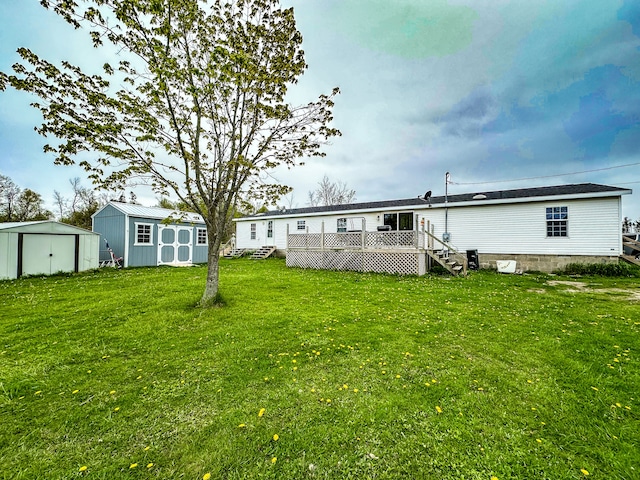 1076 N Lakeshore Rd, Harbor Beach, MI 48441 - back of property featuring a storage shed, an outbuilding, a wooden deck, and a lawn