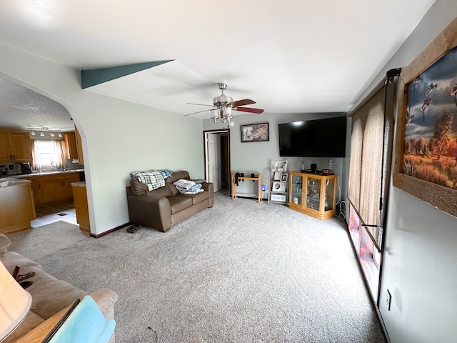 1076 N Lakeshore Rd, Harbor Beach, MI 48441 - living room with ceiling fan, light carpet, and arched walkways