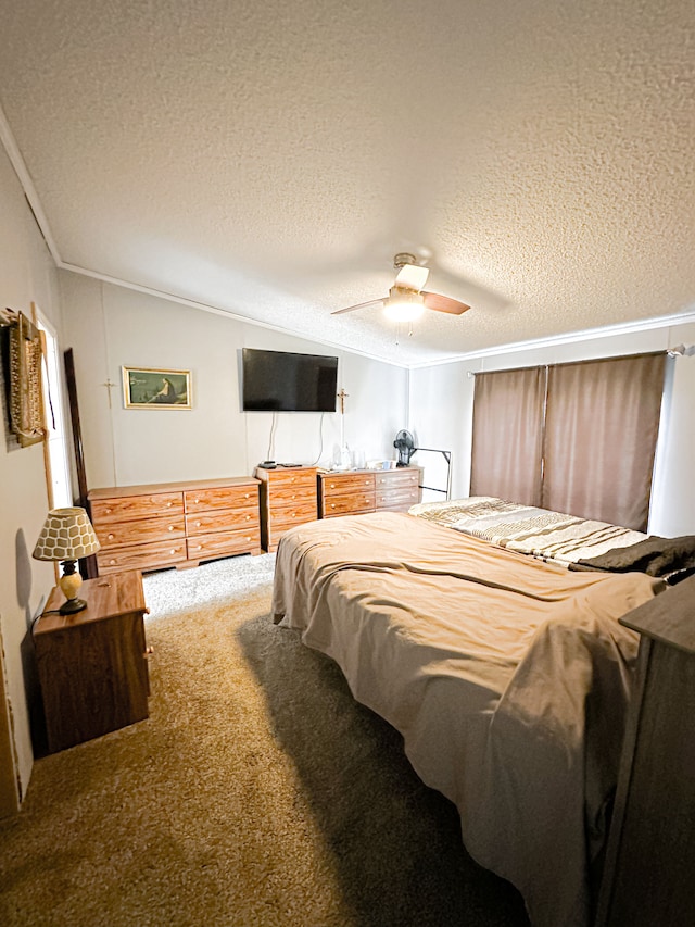 1076 N Lakeshore Rd, Harbor Beach, MI 48441 - bedroom featuring a textured ceiling, carpet flooring, vaulted ceiling, a ceiling fan, and ornamental molding