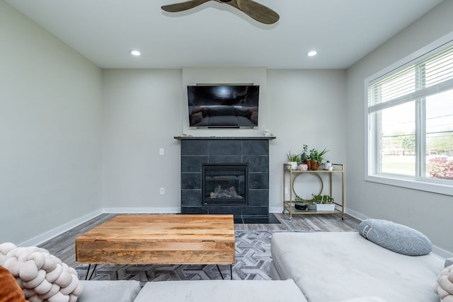 18767 Millar Rd, Clinton Township, MI 48036 - living area featuring wood finished floors, recessed lighting, a tile fireplace, ceiling fan, and baseboards