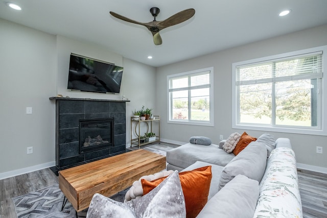 18767 Millar Rd, Clinton Township, MI 48036 - living area with a ceiling fan, baseboards, recessed lighting, a fireplace, and wood finished floors