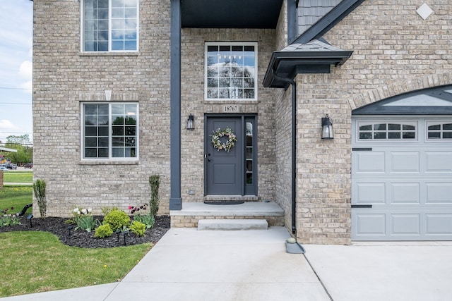 18767 Millar Rd, Clinton Township, MI 48036 - doorway to property with concrete driveway and an attached garage