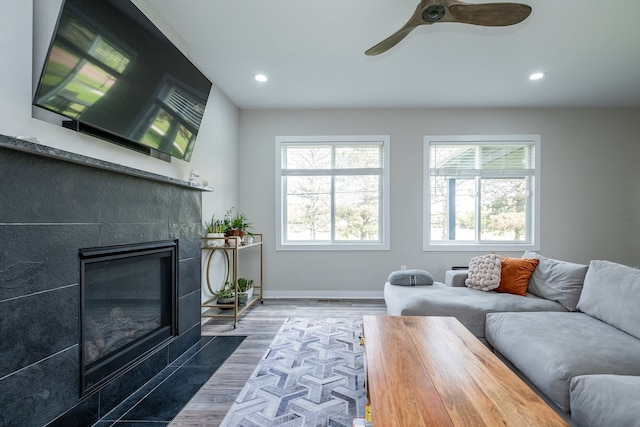 18767 Millar Rd, Clinton Township, MI 48036 - living area with recessed lighting, a fireplace, wood finished floors, baseboards, and a ceiling fan
