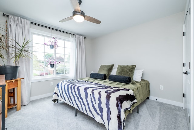 18767 Millar Rd, Clinton Township, MI 48036 - carpeted bedroom with baseboards, multiple windows, and a ceiling fan