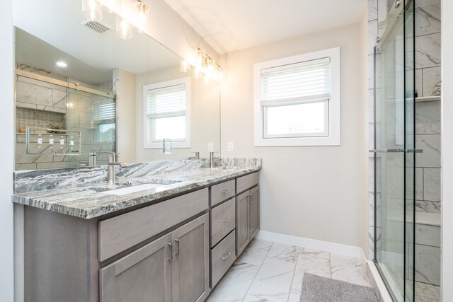 18767 Millar Rd, Clinton Township, MI 48036 - bathroom with baseboards, marble look tiles, a shower stall, and double vanity