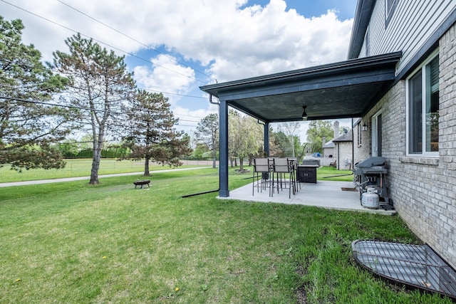 18767 Millar Rd, Clinton Township, MI 48036 - view of grassy yard featuring a patio area